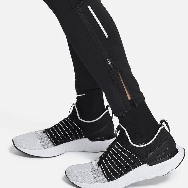 Shop Nike Dri-FIT Challenger Tights in Black. Made with stretchy fabric for unrestricted movement, plenty of pockets, and 75% recycled fibers. Perfect for running!